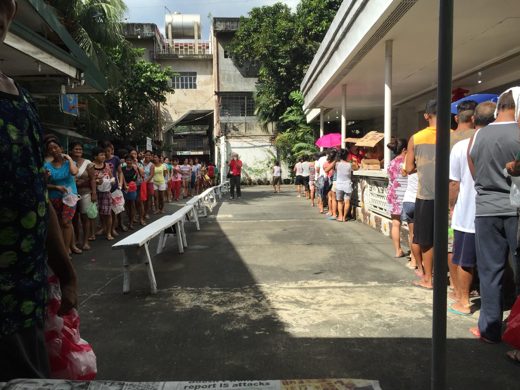 Community members lined up during a family giving event.